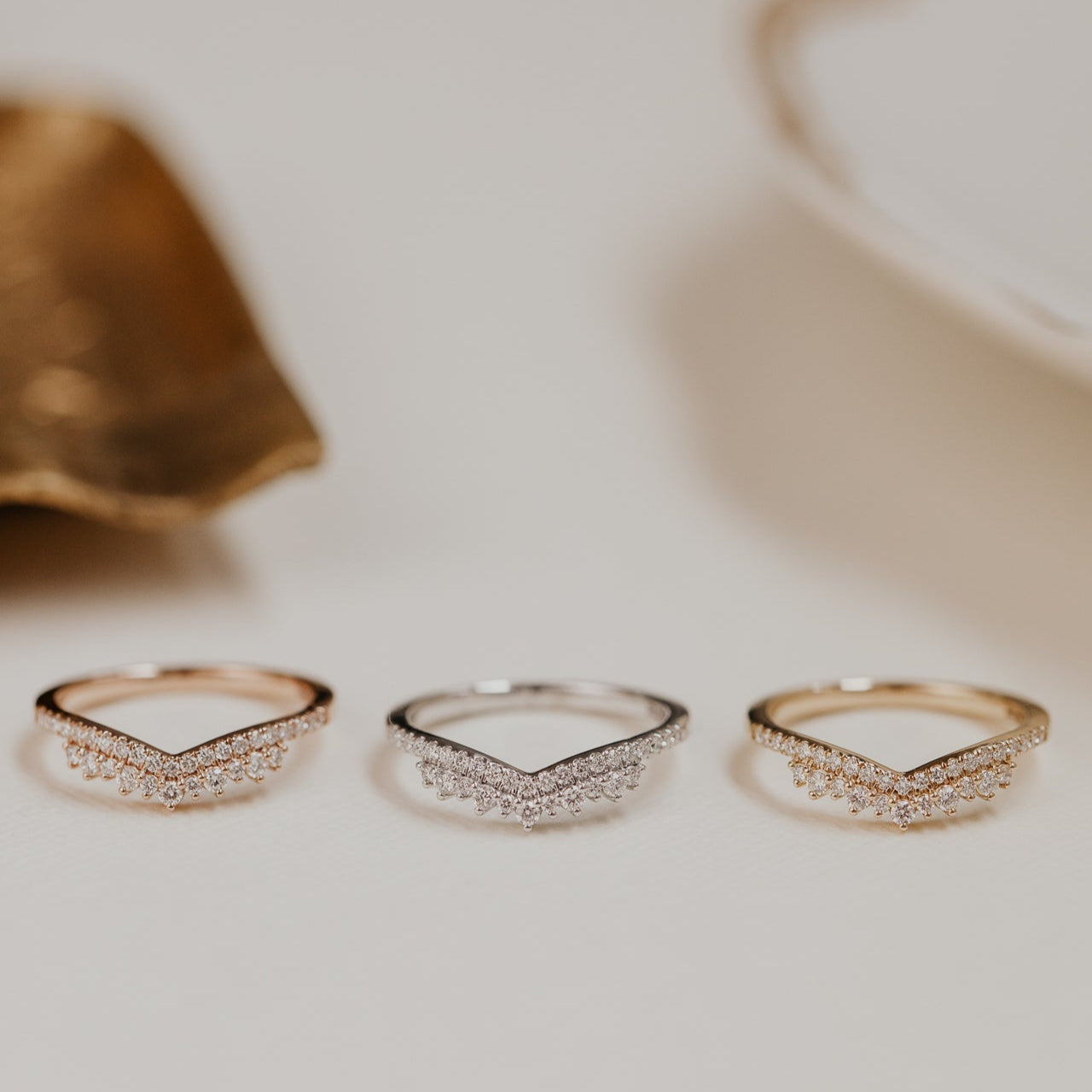 14k gold starburst tracer band featuring ~.24 cttw round pave diamonds set in a v tracer design