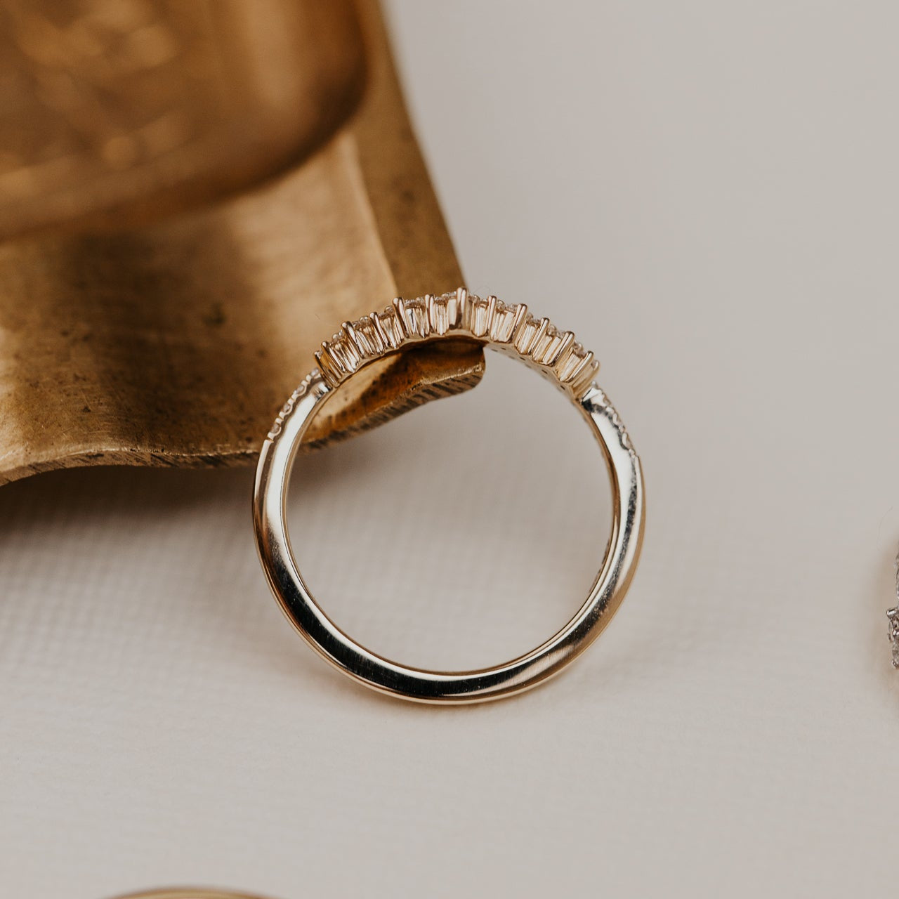 14k gold starburst tracer band featuring ~.24 cttw round pave diamonds set in a v tracer design