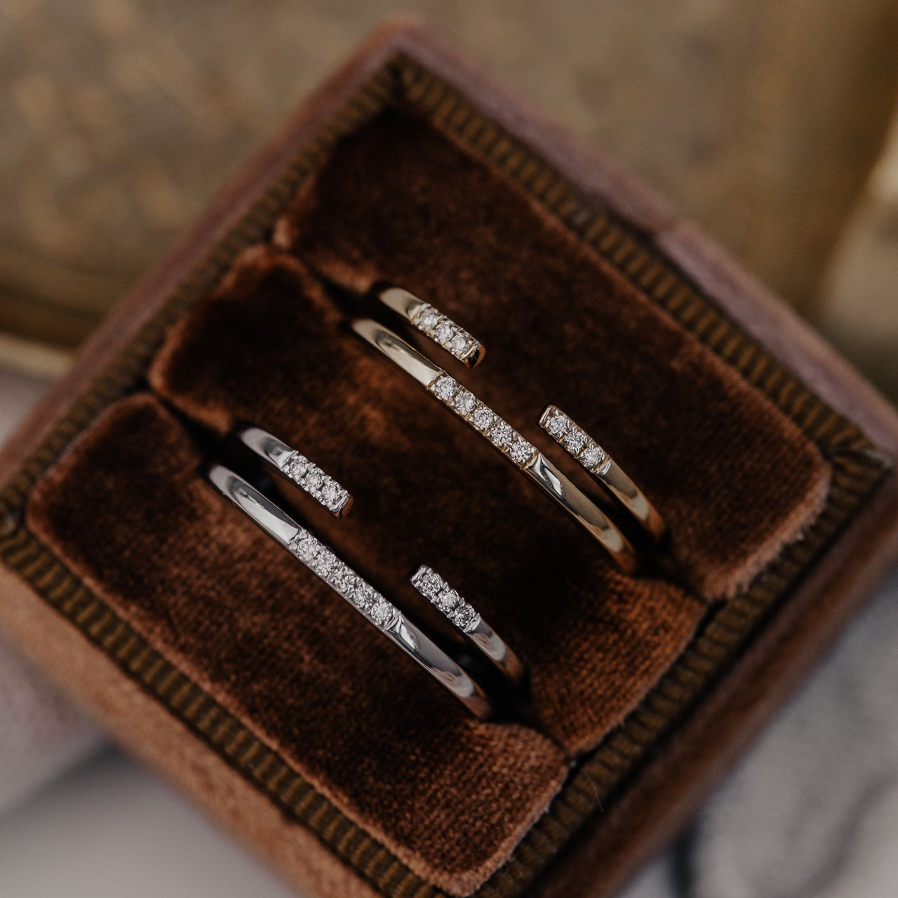 14k gold band featuring two stacked round pave bands with a total carat weight of ~.05 cttw.