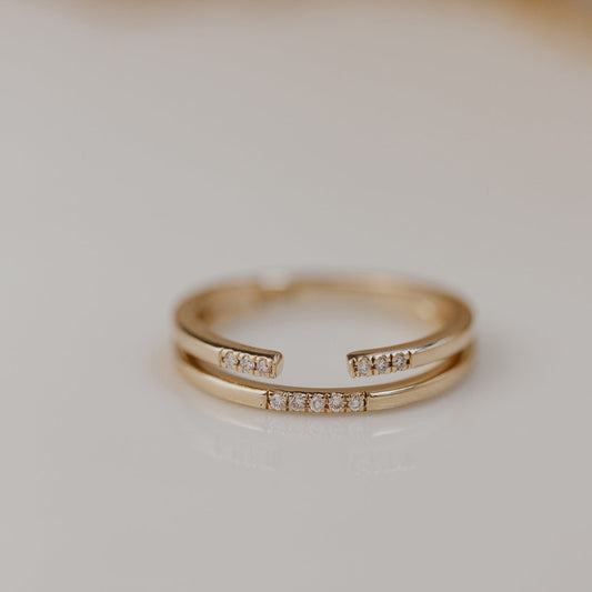 14k gold band featuring two stacked round pave bands with a total carat weight of ~.05 cttw.