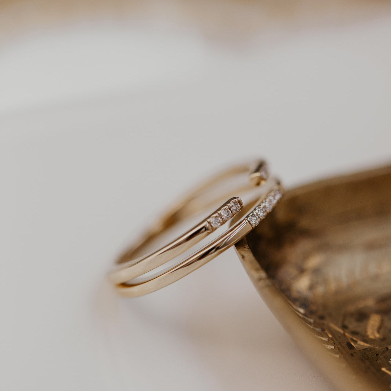 14k gold band featuring two stacked round pave bands with a total carat weight of ~.05 cttw.