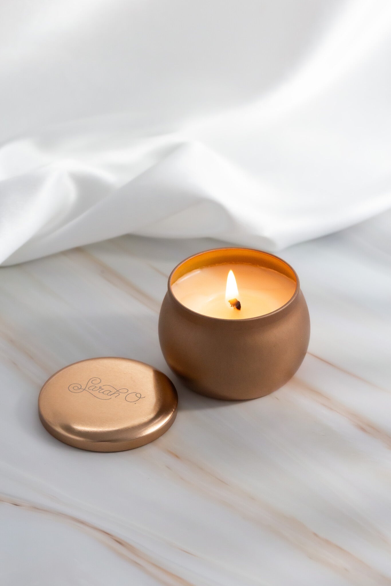 Sarah O. Signature Scent Tin Candle