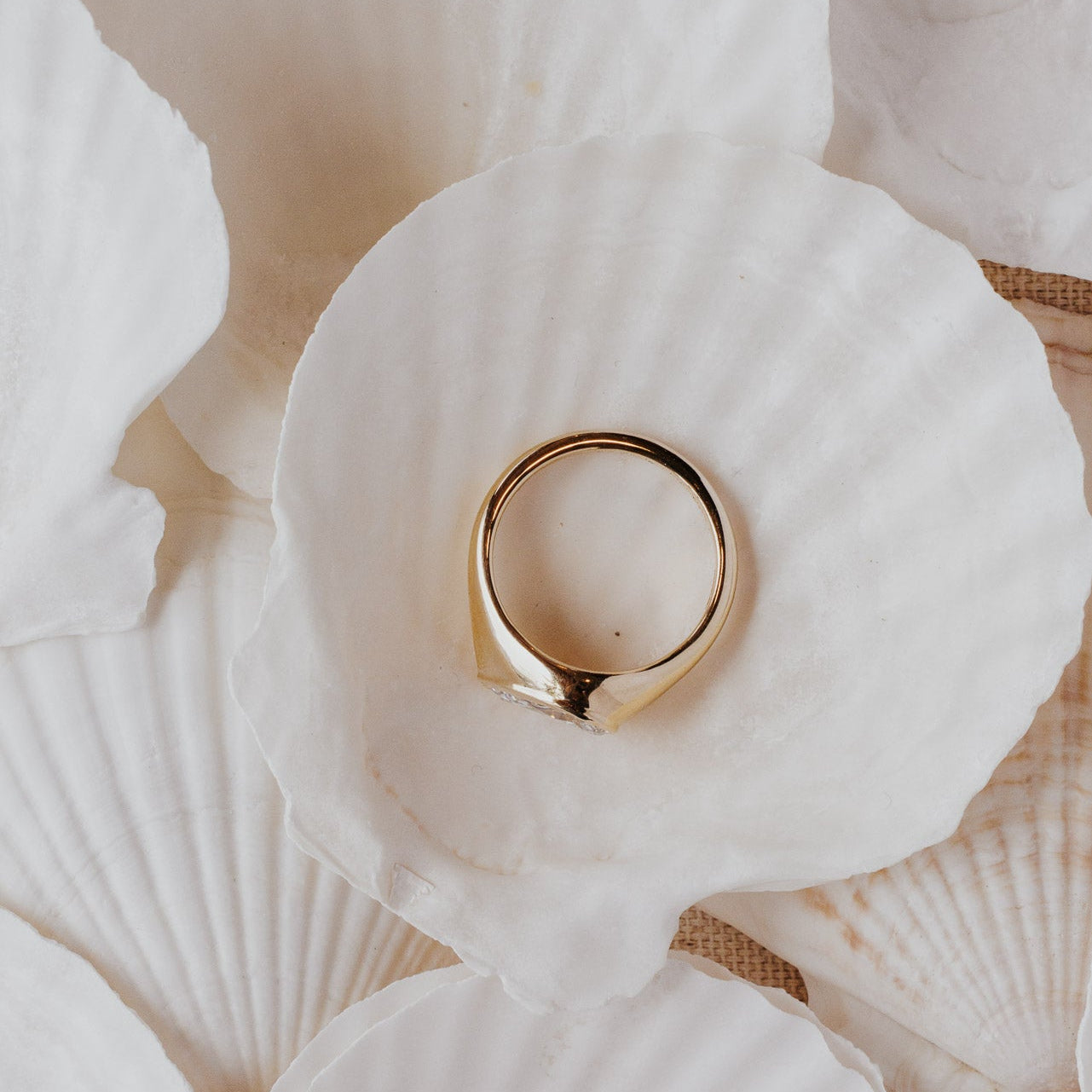 The Santorini Pear Ring in 14k yellow gold featuring a lab-grown pear diamond bezel set on a tapered band, shown from above to display the smooth gold interior and band profile.