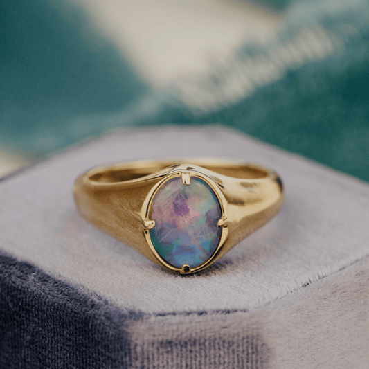 Triplet Opal 1.30 ct Signet Ring on a velvet ring box.