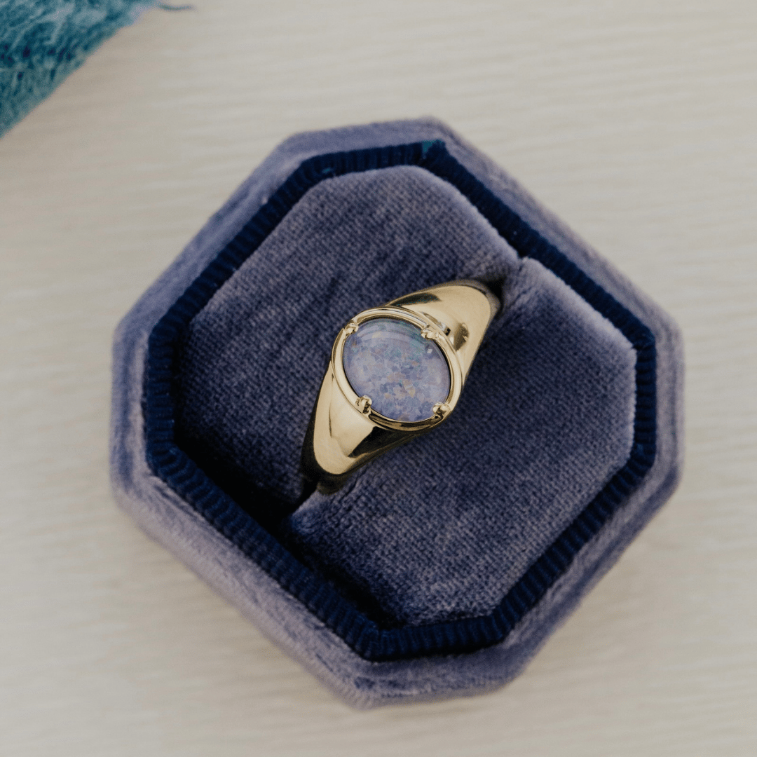Triplet Opal Signet ring in a blue velvet ring box.