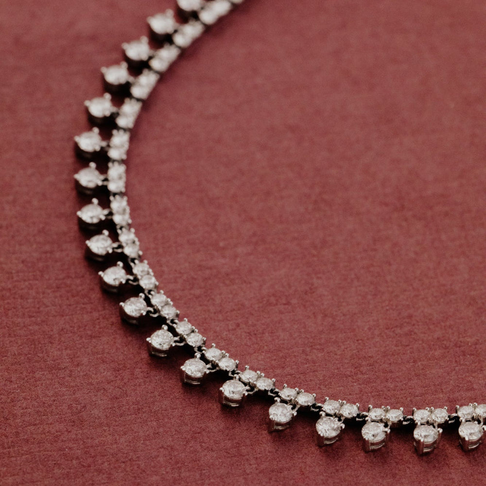 Diamond necklace on a red background.