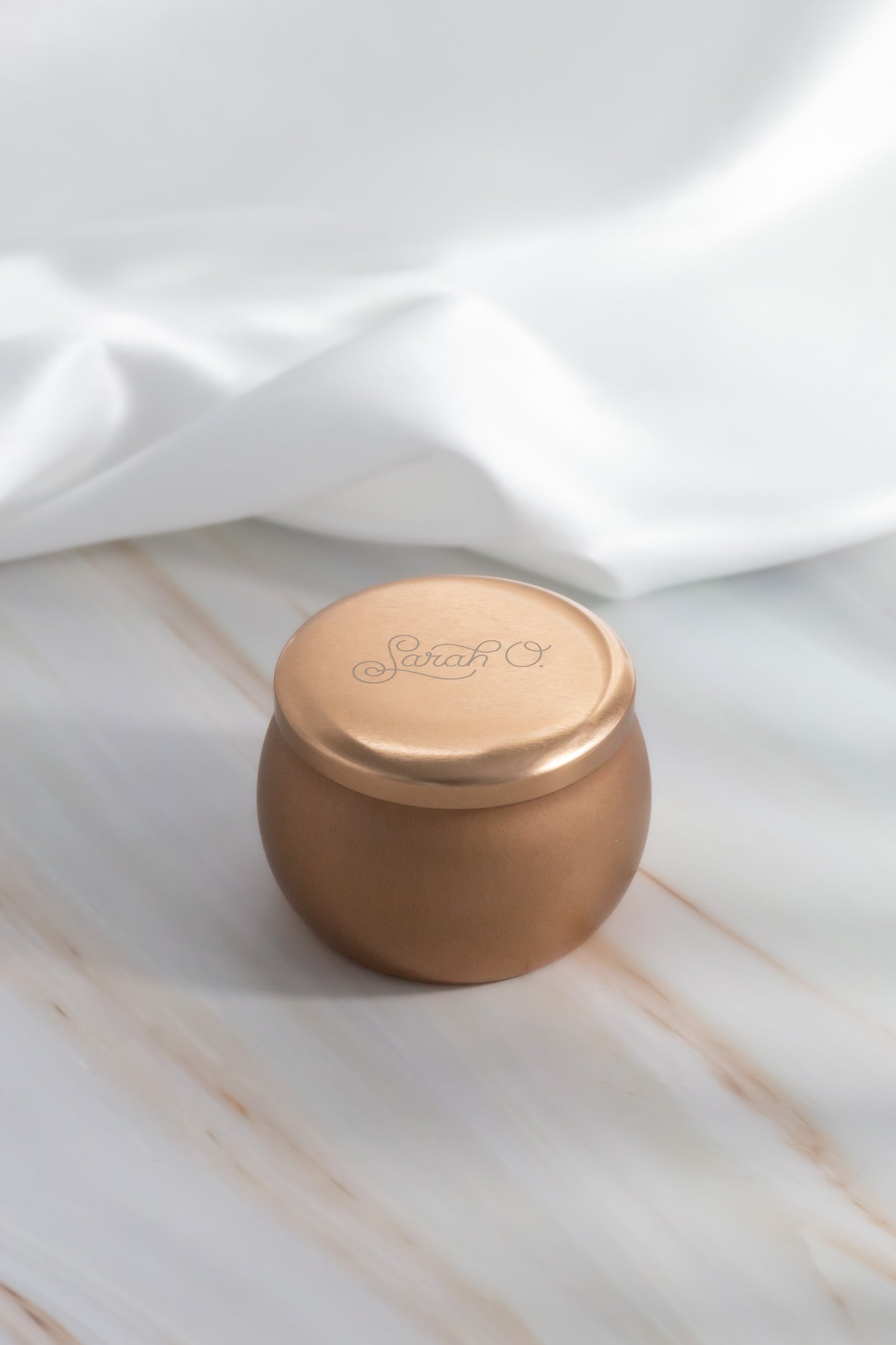 Sarah O. Signature Scent Tin Candle