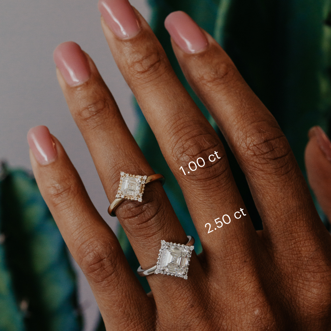 Two diamond rings on a hand with labeled carat weights.
