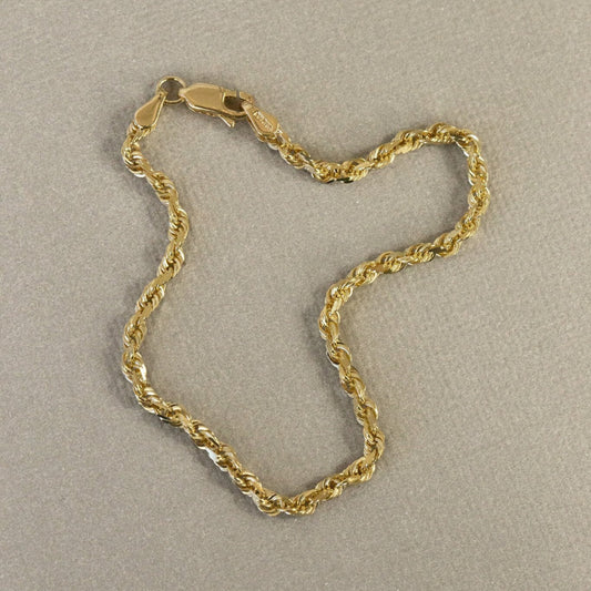 Solid rope chain bracelet with a diamond cut design, displayed on a neutral background.