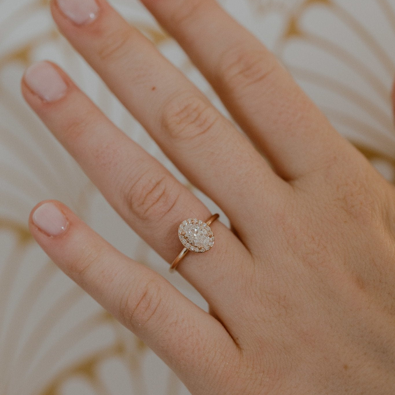 The Audrey oval diamond engagement ring with a diamond halo