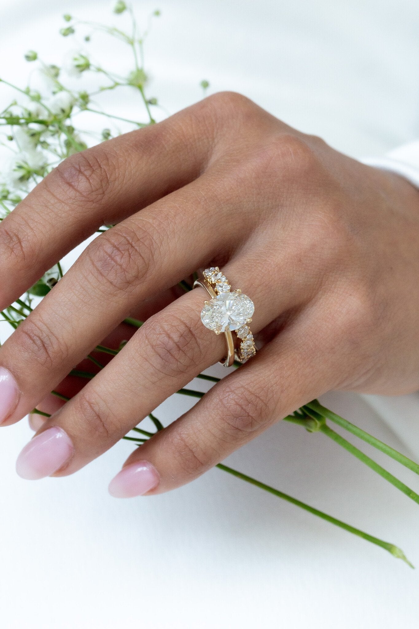 The Eloise Band paired with The Maeve Oval Solitaire with a 3 ct center stone.
