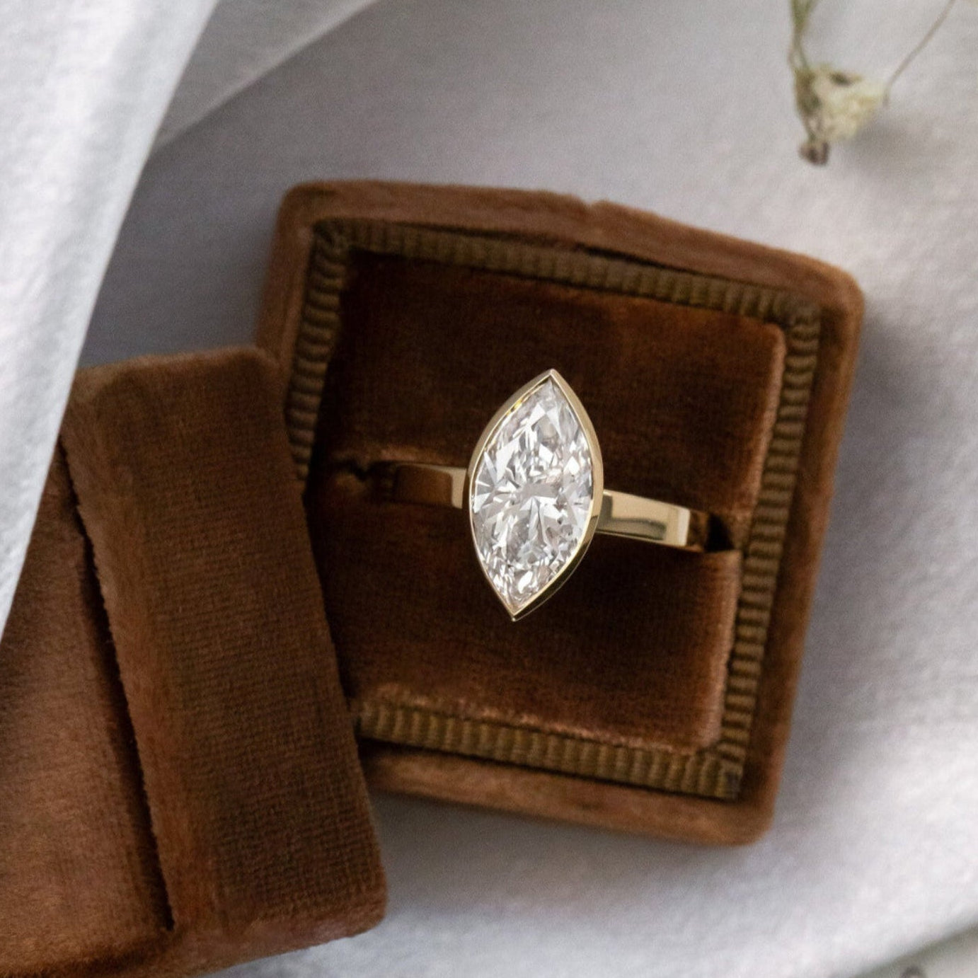 The Elena marquise solitaire engagement ring in 14k yellow gold