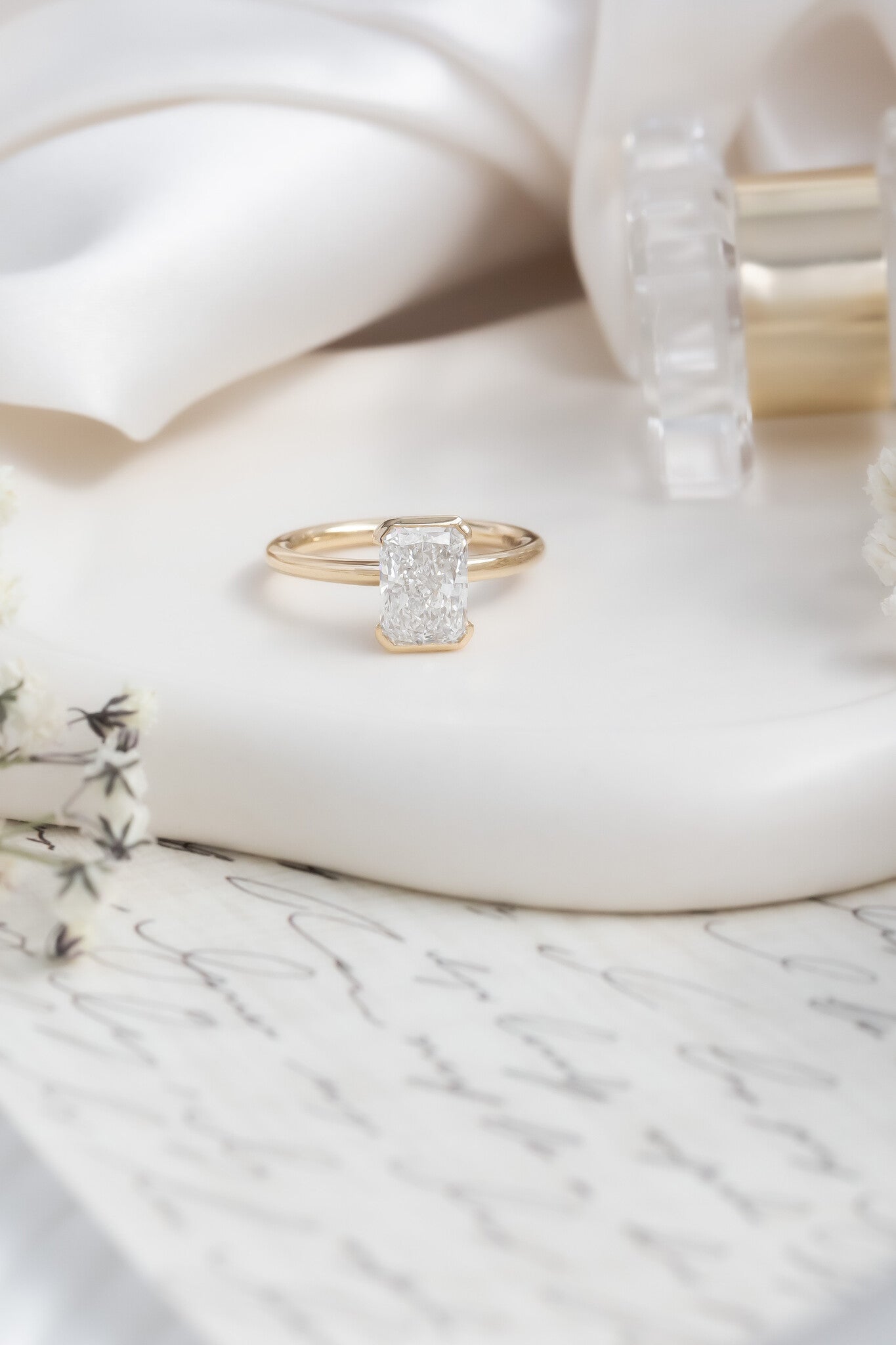 The Zadie Radiant Cut Half Bezel Solitaire Ring in 14k Yellow Gold