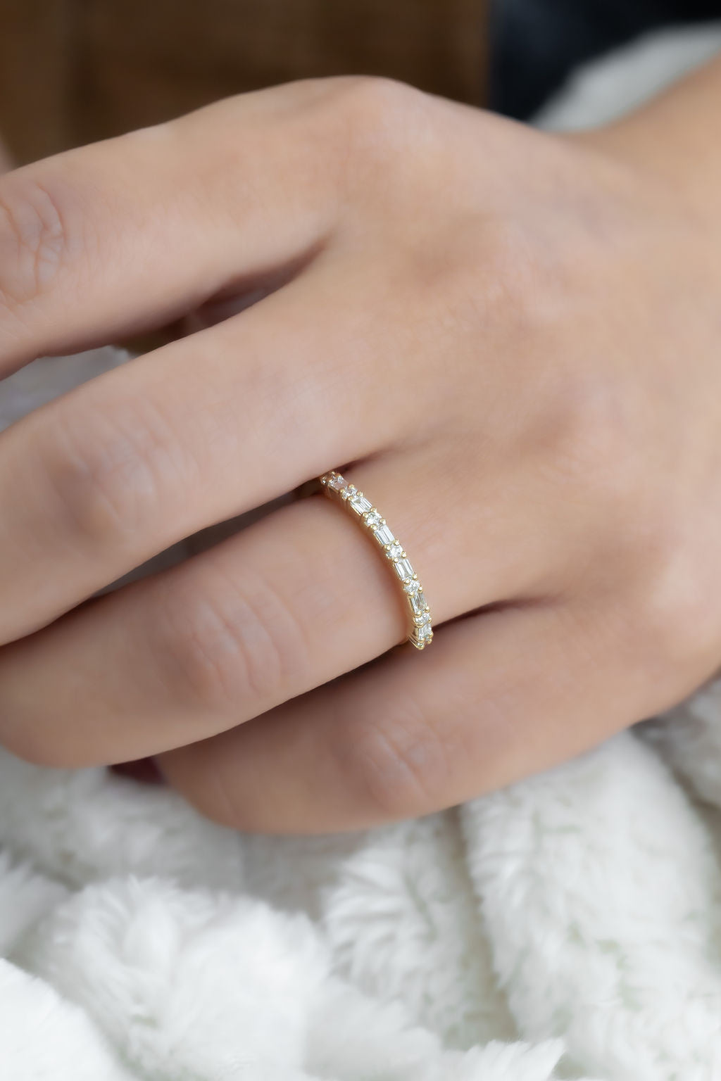 The Katherine Diamond Band in 14k yellow gold on a models hand