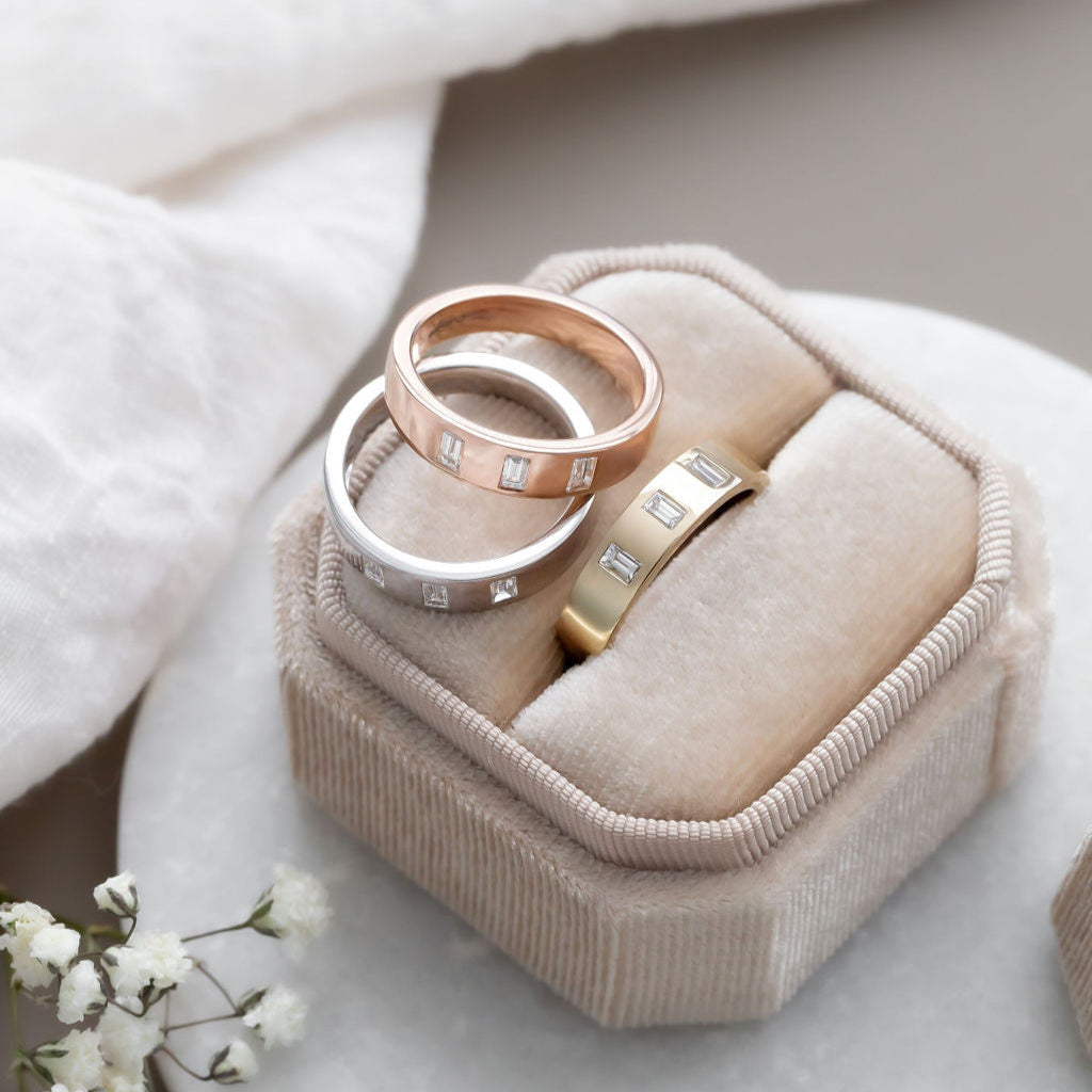 The Jaden Three Baguette Wedding Band in 14k yellow, white, and rose gold