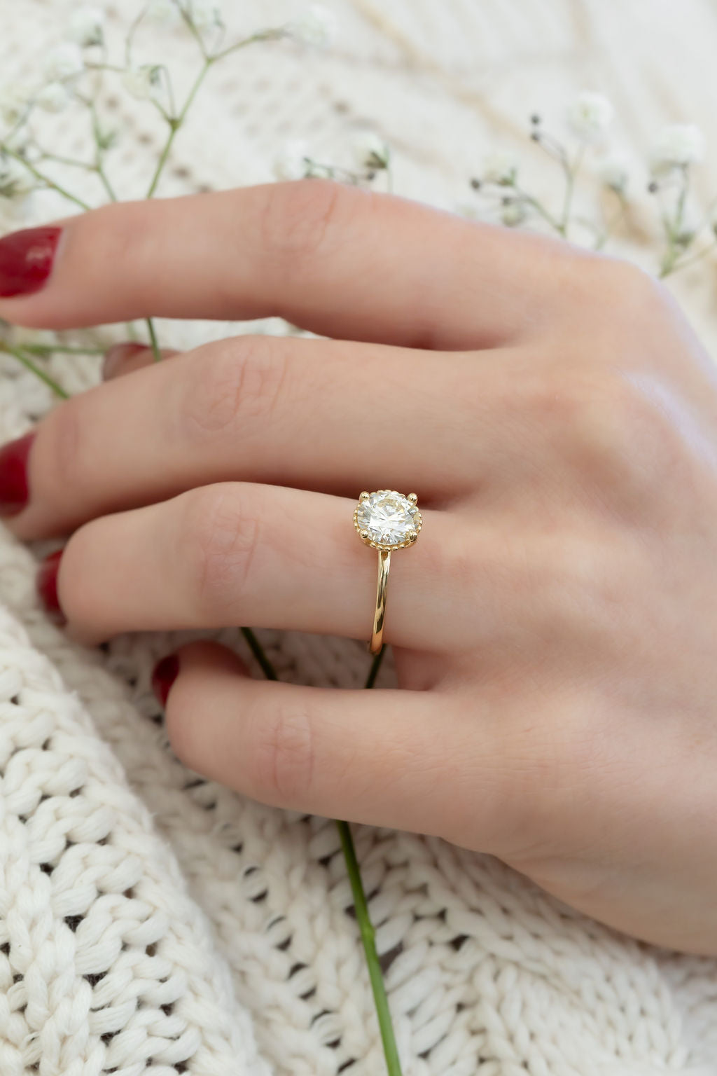 The Charlotte 1.61 ct Round Natural Diamond Solitaire on models hand